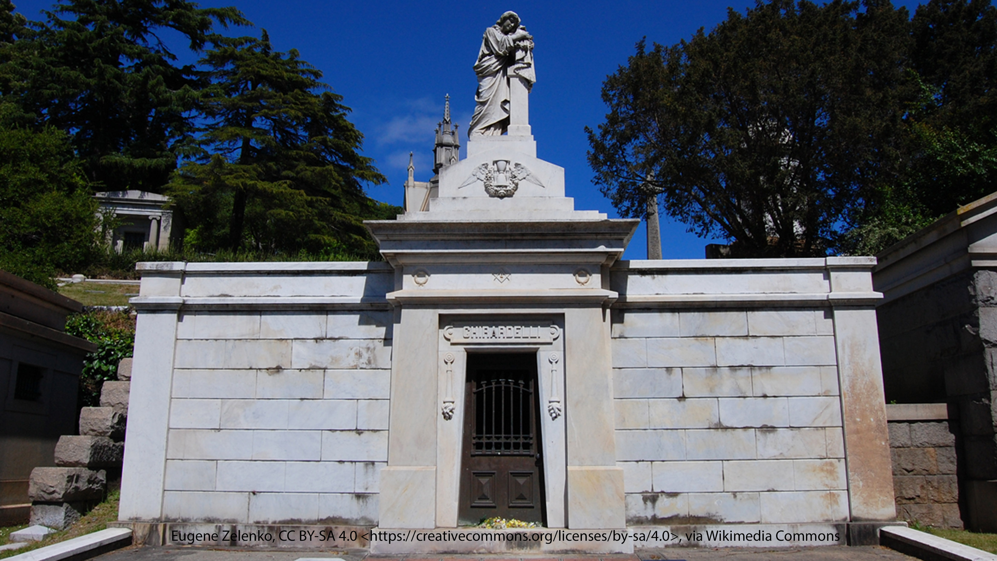 Photograph of the Ghirardelli Tomb at Mountain View Cemetery, showcasing its ornate stone architecture and detailed design